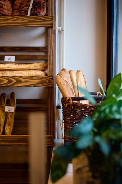 istock Freshly baked baguettes displayed in a wicker basket in a bakery 2215007227
