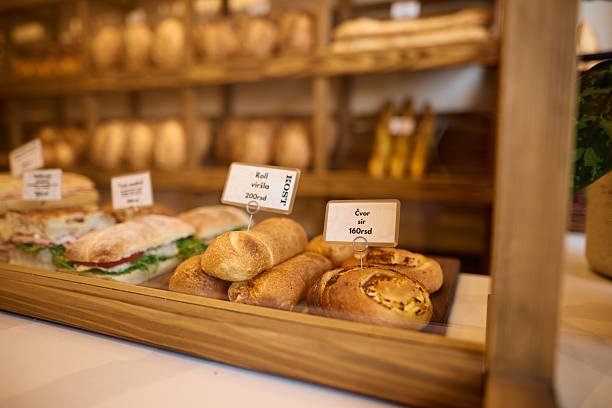 istock Display of sandwiches, rolls, and pastries tempting customers in a bakery window 2215007465