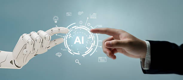 istock Human Hand Reaching Toward Robotic Hand with AI Icon Symbolizing Connection 2215008962
