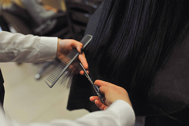 istock Professional hairdresser working with client in salon 2215012172
