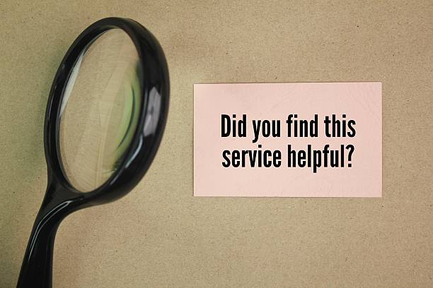 istock magnifying glass and colored paper with the word question Did you find this service helpful? 2215012464