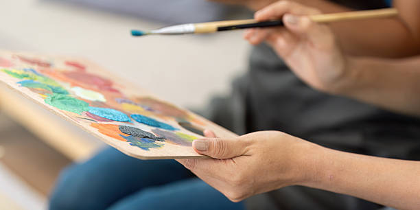 istock Lesbian couple expressing creativity through painting at home 2215013072