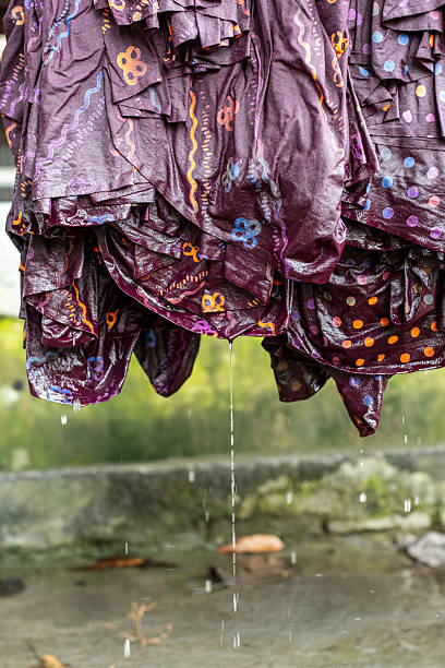 istock Wet batik cloths drying with water droplets 2215013287