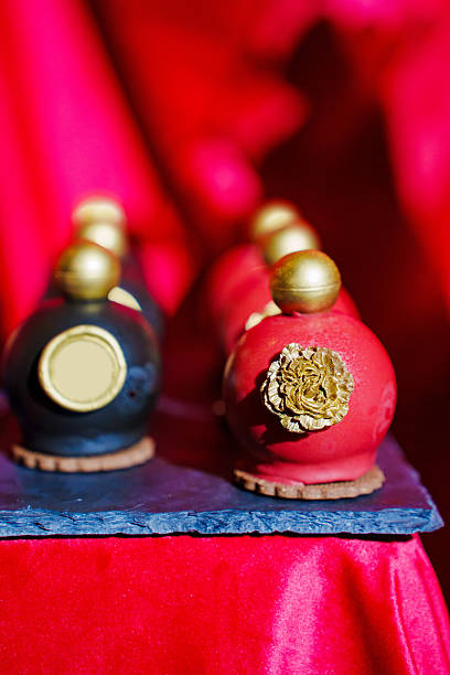 istock cake, sweets in the shape of perfume bottles and candles 2215014808