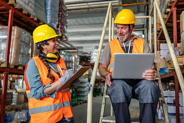 istock Warehouse workers collaborate on logistics and inventory management in a busy distribution center during daytime hours 2215017882