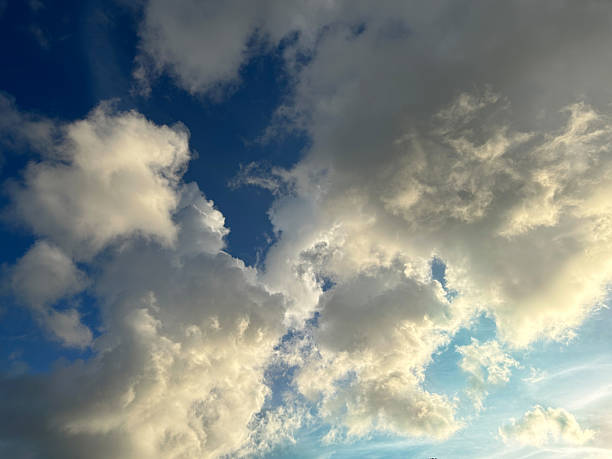 istock Beautiful, dynamic cloud formations in a clear blue sky at midday 2215021291