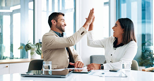 istock High five, teamwork and people with smile, business and happy for ad campaign performance and media buyer. Celebration, success and achievement for digital marketing in office, gesture and excited 2215022093