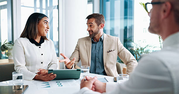 istock Office, documents and business people in meeting on tablet for online project, discussion and consulting. Corporate, finance report and men and women on digital tech for research, review and feedback 2215022116