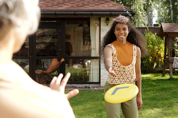 istock Playing Frisbee in Backyard on a Sunny Afternoon 2215022351