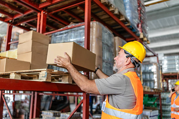 istock Warehouse workers organize and examine merchandise in a distribution center for e-commerce fulfillment 2215022943
