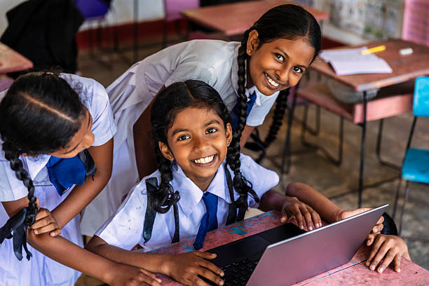 istock Sri Lankan school children using a laptop in classroom 2215025328