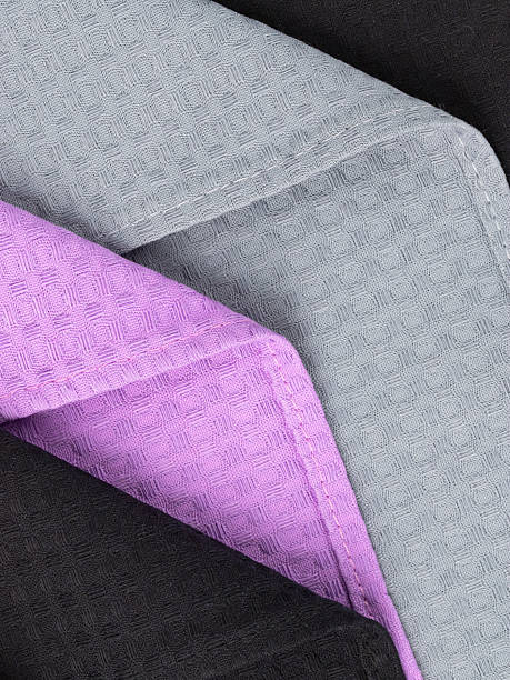 istock cotton waffle towels for the kitchen hang on hooks on a bracket against a white wall background 2215026747