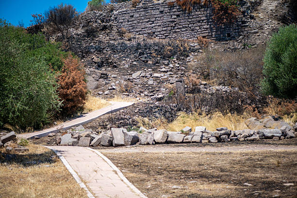 A close-up view of the weathered stone walls and structural parts of an ancient amphitheater, highlighting the grandeur and enduring beauty of classical architecture.