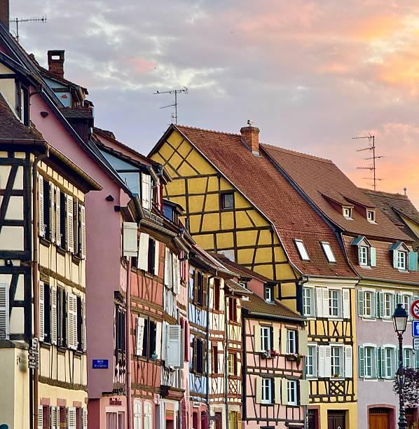 Colmar, France: May 14, 2025 -  Medieval build with windows and wooden shutters in Colmar. It is a village Alsace region of northeastern France.