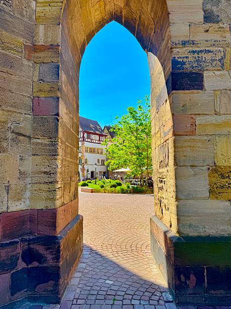 Colmar, France: May 14, 2025 - A stone archway in Colmar, a medieval town located in  Alsace region of northeastern France.