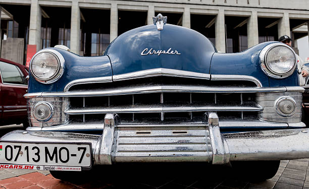 Calafell, Spain – May 31, 2025: A close-up of a classic 1967 Chrysler 300's front end, highlighting its retro design, chrome details, and grill. Captured on 35mm film