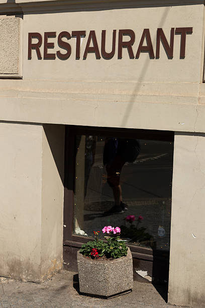 istock Charming Restaurant Entrance with a Beautiful Flower Planter 2215032376