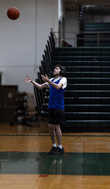 istock Neurodivergent man shoots a basketball 2215033274
