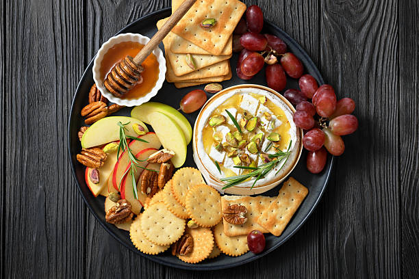 istock Baked Camembert with honey, pistachios, top view 2215034904