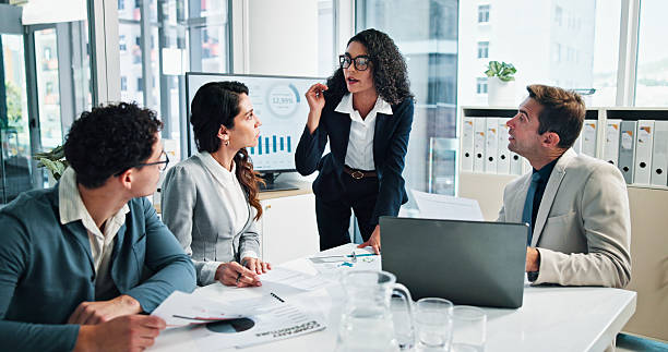 istock Office, business people and project manager with documents for feedback, meeting and finance update. Team, accountants and financial advisor with paperwork for risk management, discussion and explain 2215036067