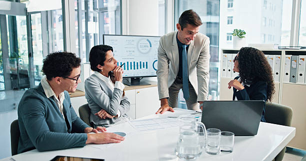 istock Finance, manager or business people with shareholders in discussion for paperwork, charts data or capital growth. Planning, budget graphs or financial advisors in meeting with directors or documents 2215036087