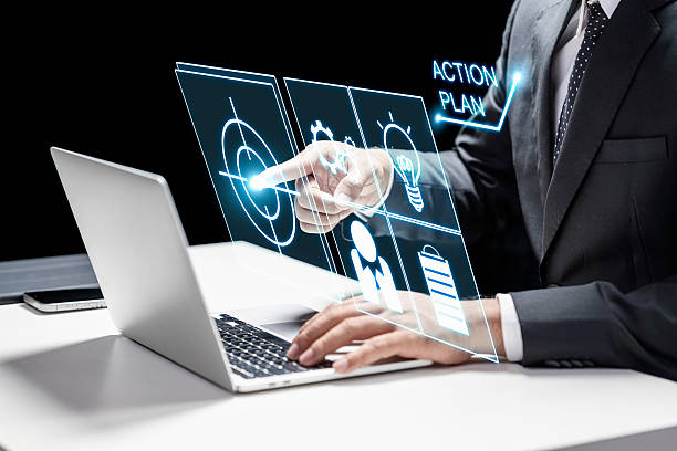 istock Businessman using a laptop while touching the icon of target. Technology innovation on a virtual screen. Concept of the action plan 2215038135