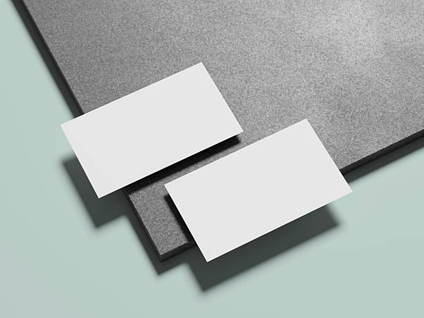 istock Two white business cards elegantly positioned on a marble surface, offering a stylish and minimalist appearance. 2215039755