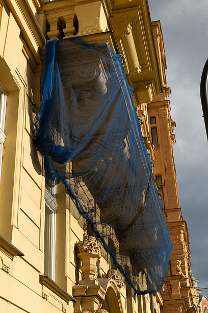 istock Construction Netting Displayed on the Facade of a Building Project 2215040122