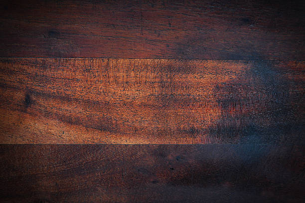 Blank empty retro vintage style old antique ancient textured rustic burnt wooden background wood grain texture, black burn damages, old weathered rough plank like cutting board backdrop with detail like deck or parquet flooring