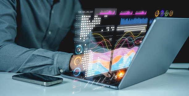 istock A businessman uses a laptop to access an AI-powered business analytics dashboard, showcasing charts, metrics, and KPIs. 2215044278