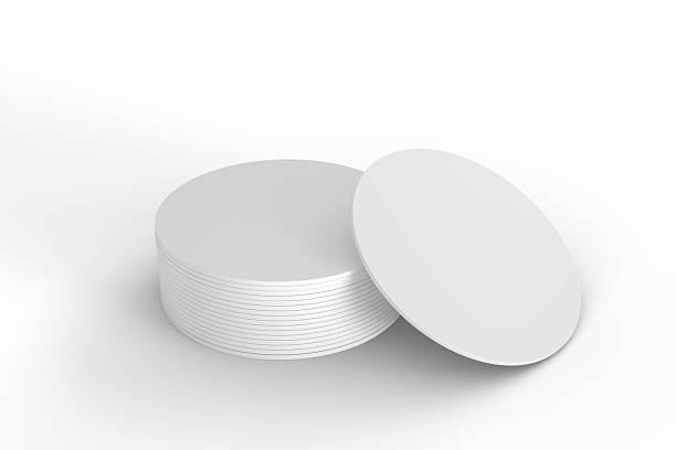 istock Round drink or beer coaster mockup set, isolated on background. Protection bierdeckel for beer glasses, bottle, can, cup holder. Empty bottle coaster lying template for beverage branding. 3d render 2215045415