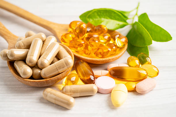 istock Alternative medicine herbal organic capsule drug herb. 2215046099