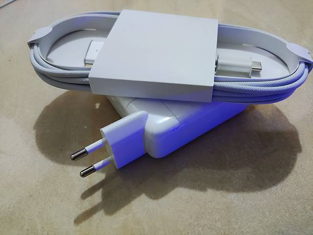 istock Close-Up of Modern USB-C Wall Charger with Braided Cable on Marble Surface 2215052855