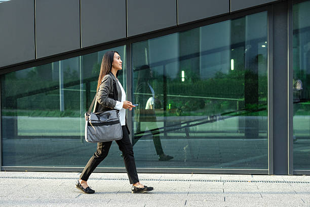 istock Asian businesswoman after work 2215054035