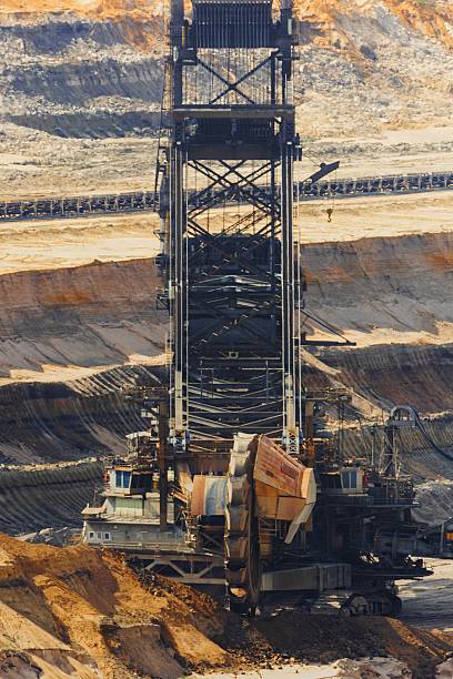 istock a gigantic excavator bucket in a coal mining area 2215055426