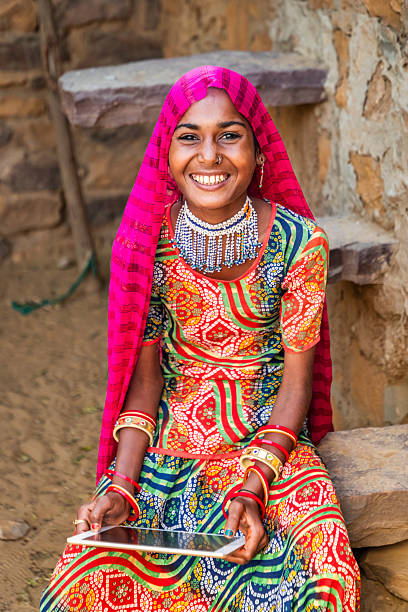 istock Happy Indian girl using a digital tablet, India 2215059333