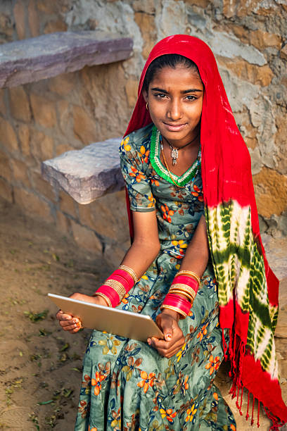 istock Happy Indian girl using a digital tablet, India 2215059626