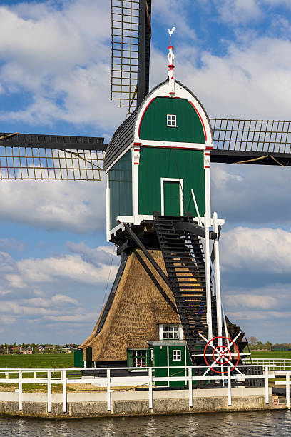 istock Traditional Dutch Windmill in Groot Ammers, Netherlands, standing tall against a cloudy sky 2215063806