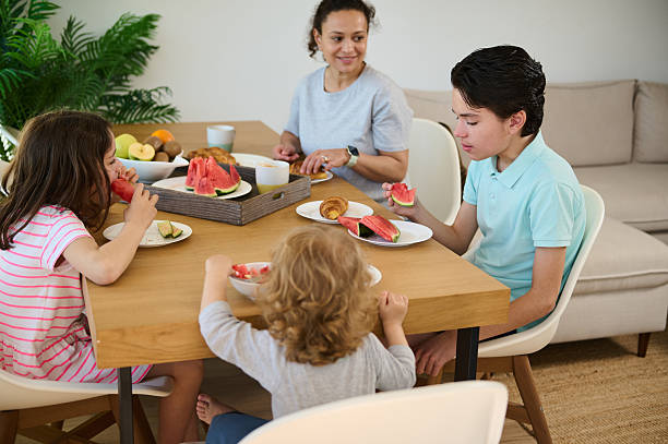istock Family Enjoying Breakfast Together in a Modern Cozy Home Setting 2215064137