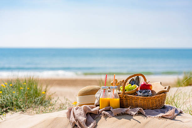 istock Beach picnic with fresh fruits and juice 2215064733