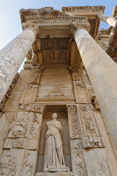 Selcuk-Izmir, Turkey - June 22, 2019: Tourists walking around in UNESCO heritage site Ephesus on sunny day. Celsus Library one of the most beautiful structures in Ephesus