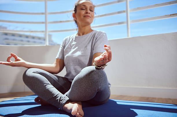 istock Woman Practicing Mindfulness Meditation Outdoors on a Sunny Day 2215066106