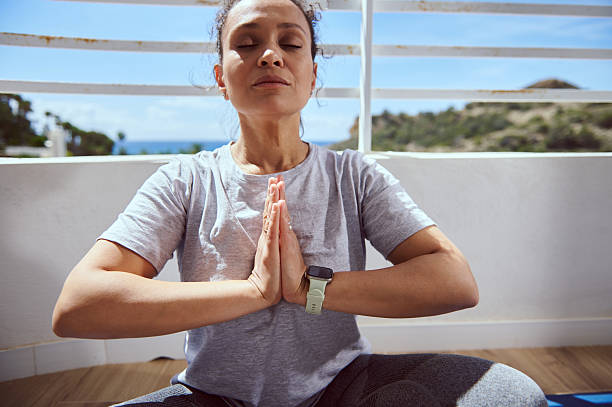 istock Serene Young Woman Meditating Outdoors in a Peaceful Scenic Setting 2215066219