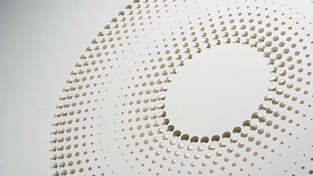 istock Minimalist circular paper cut artwork with dot pattern design in neutral tones, captured in modern still life composition 2215071369