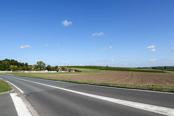 istock A road with a white line down the middle and a blue sky above 2215077308