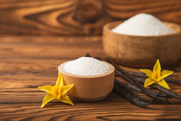 istock Aromatic vanilla sugar. Vanilla pods. Vanilla sticks, brown and white sugar  on  background. Vanilla flowers, spices and herbs for desserts and baking. Space for text. Copy space 2215079949