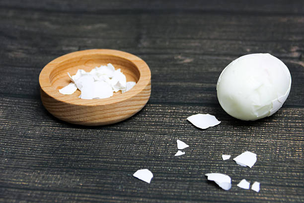 boiled eggs peeled from the shell on a wooden cutting board