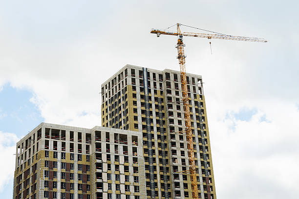 istock New building apartment with modern design. Architecture skyscraper against cloudy sky 2215081318