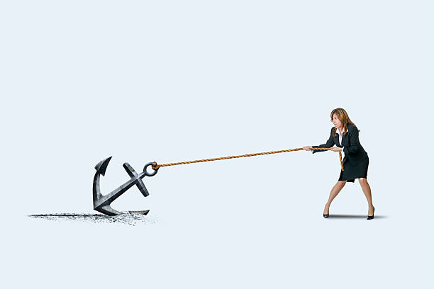 istock Woman Drags An Anchor 2215082666