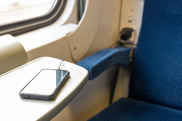 smartphone charging on the train. Railway and transportation concept.